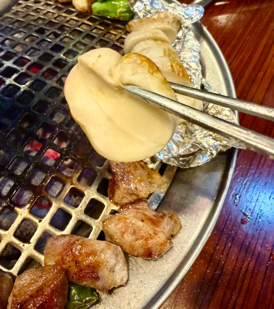 Whole mushroom grilled inside foil