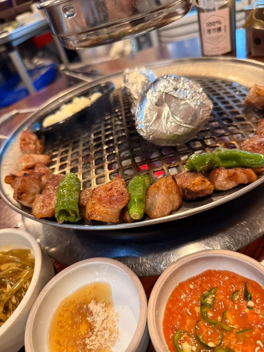 Side dishes including lettuce wraps and kimchi