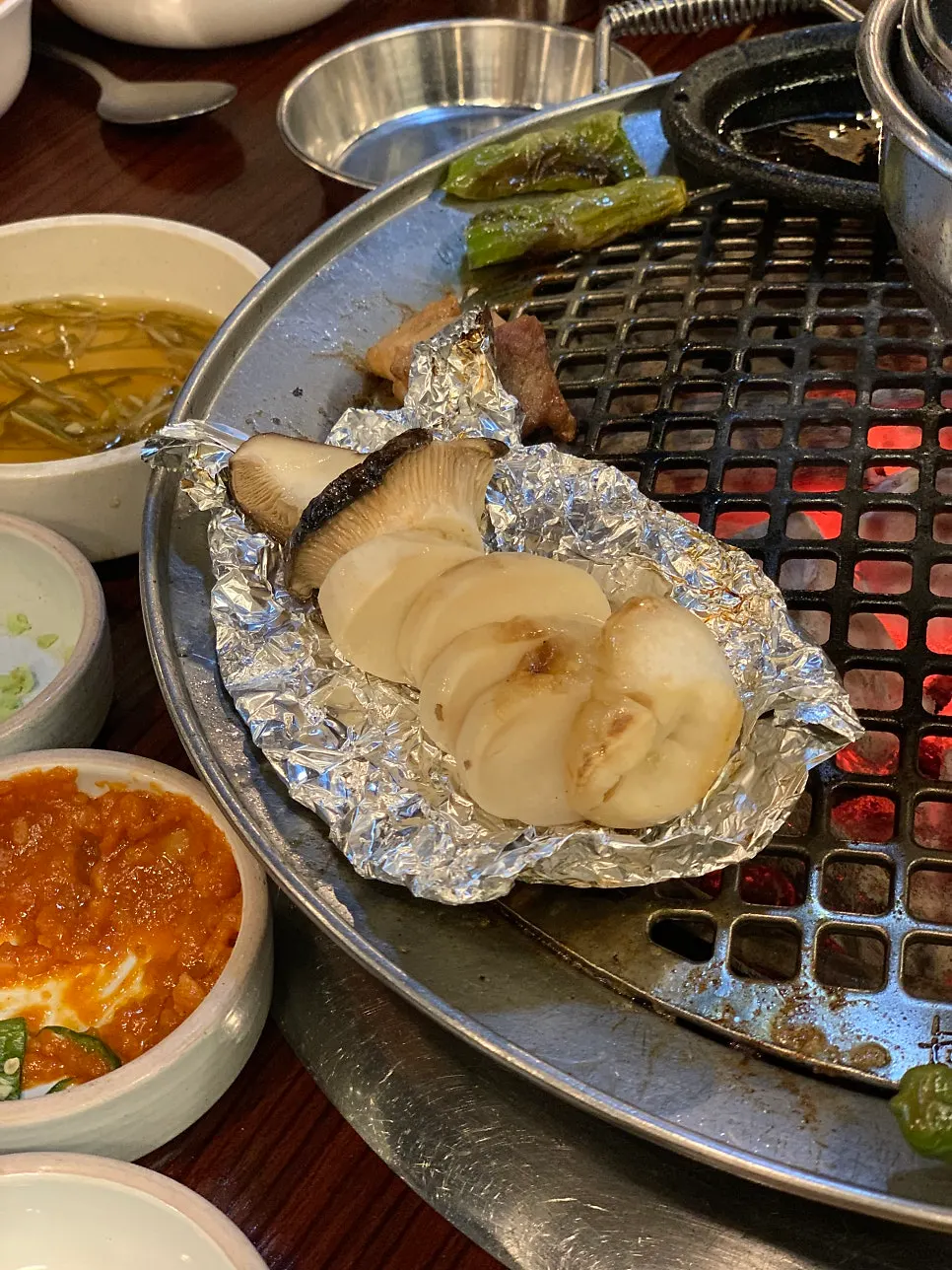 Mushrooms grilled in foil and sliced