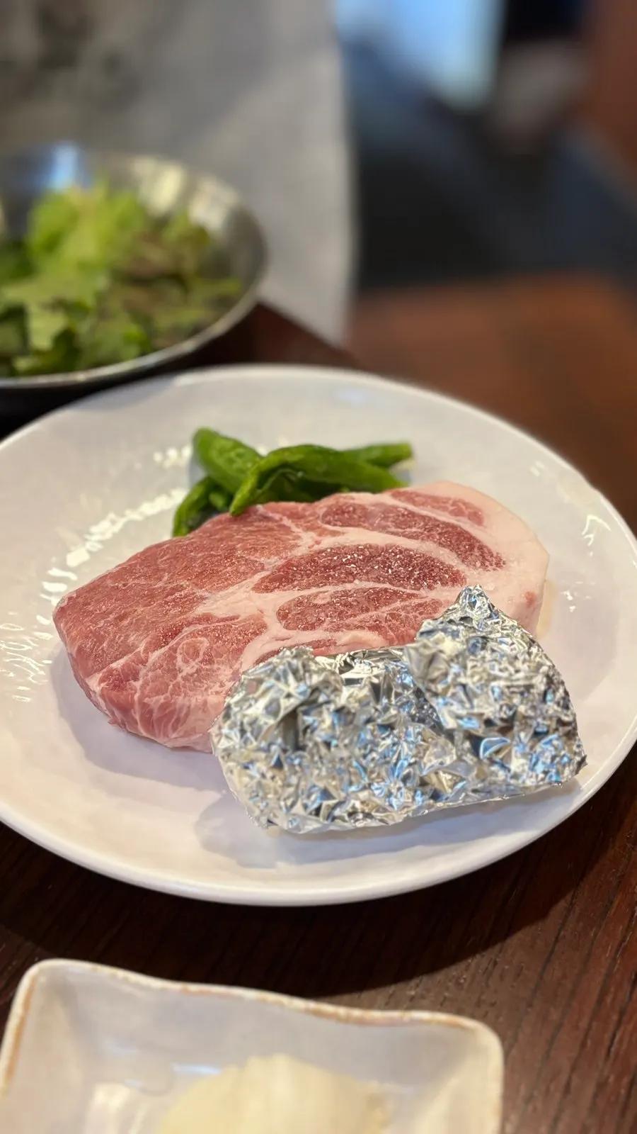 Pork neck searing over the charcoal fire
