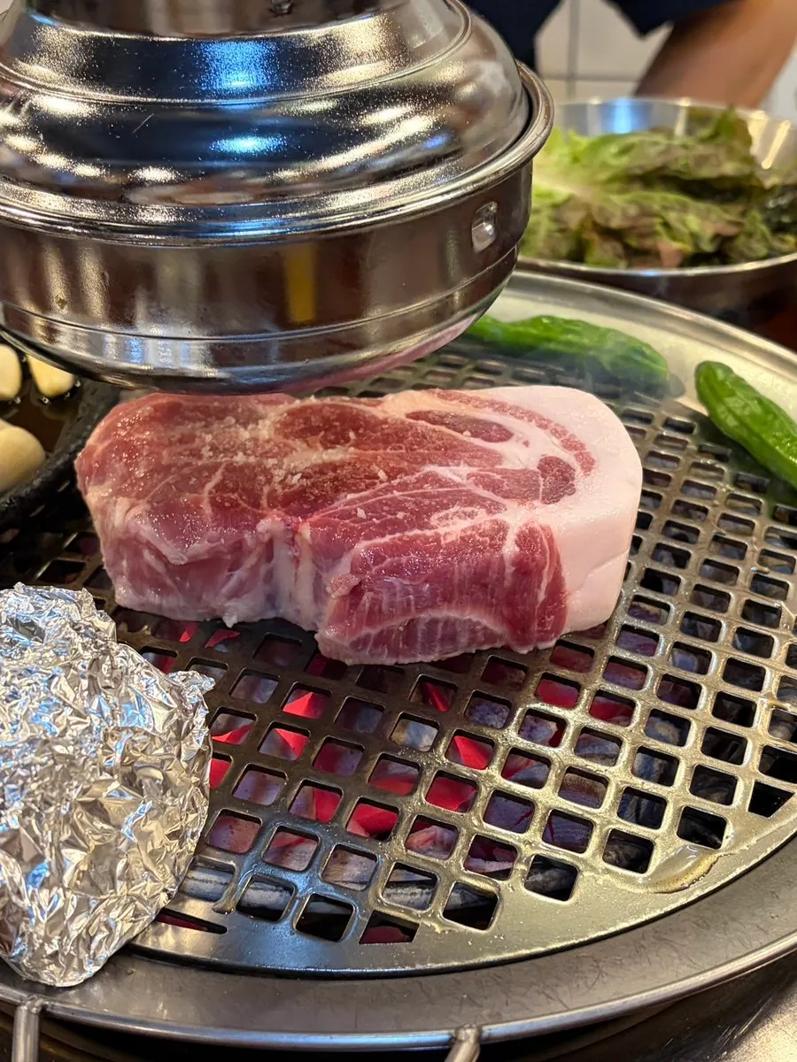 Two servings of thick-cut fresh pork neck