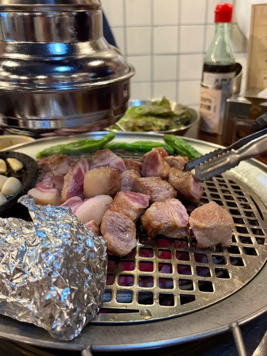Staff cutting the pork neck with scissors
