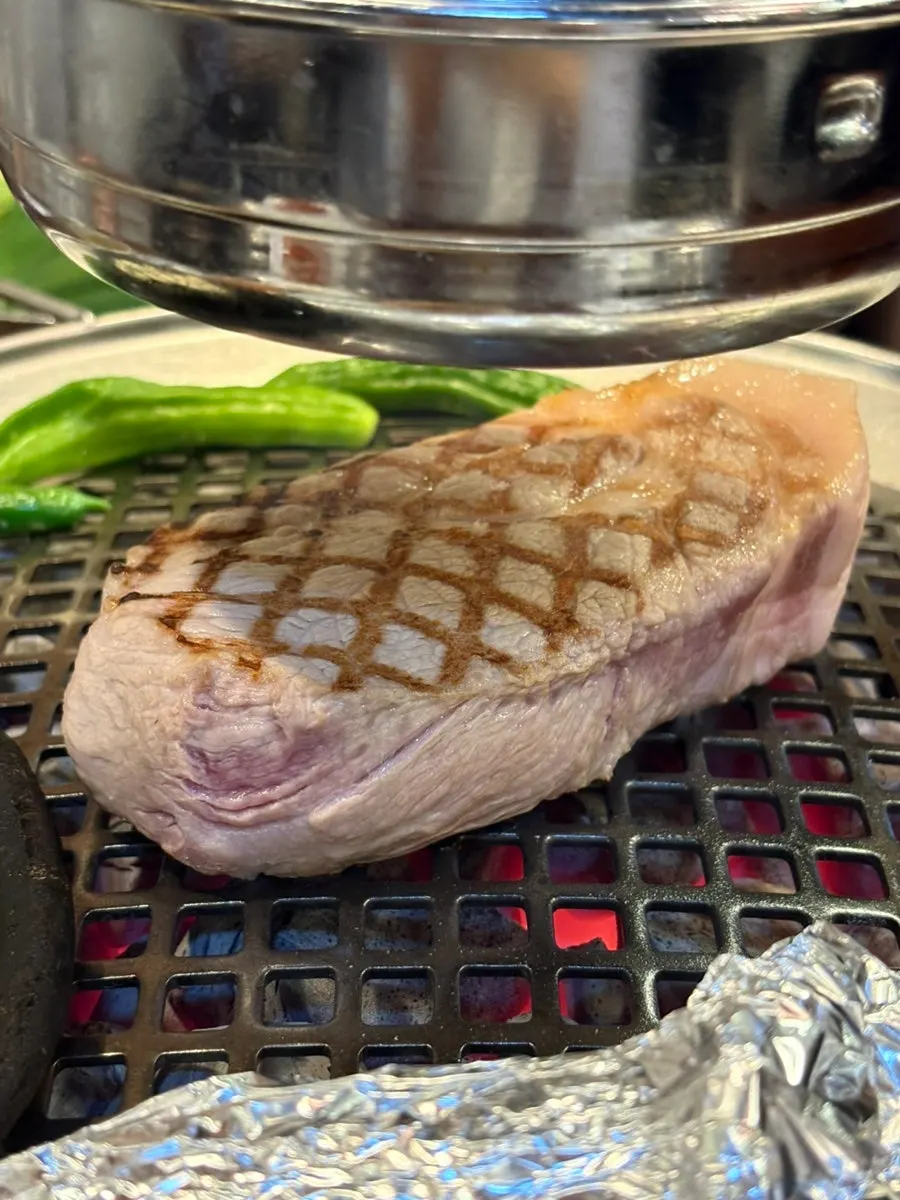 Thick dongnae pork neck on the grill