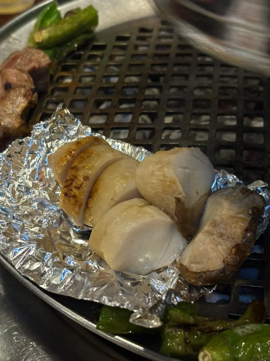 A piece of pork neck dunked in melchorim