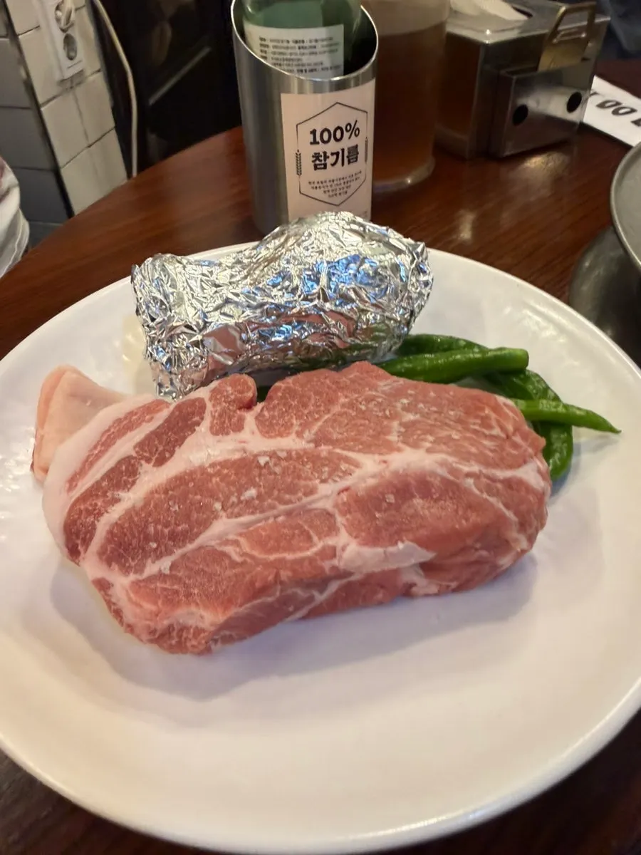 Thickly sliced domestic pork served at the table