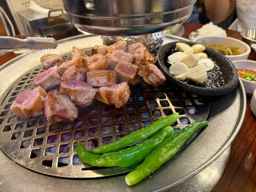 Thick pork cooking on the grill