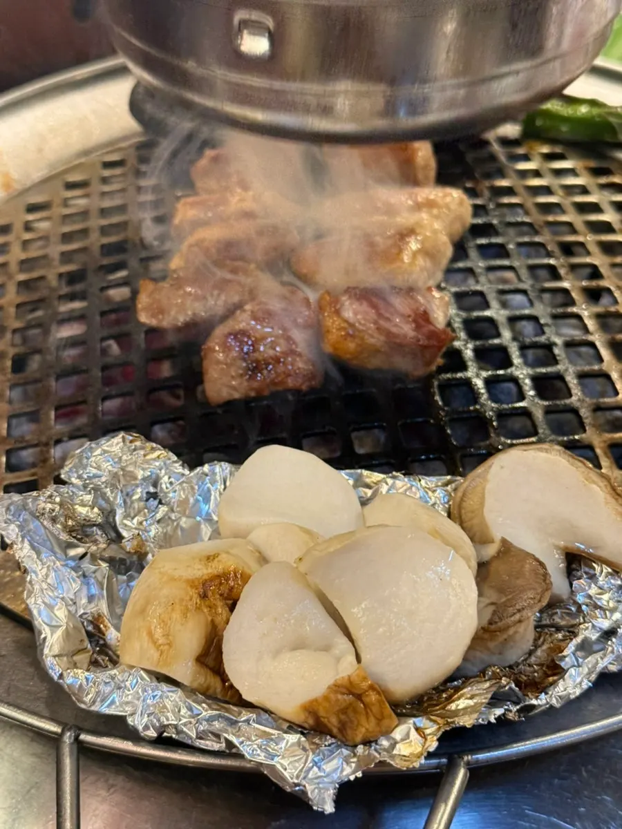 Enjoying soju with meat at Dongnaejeong