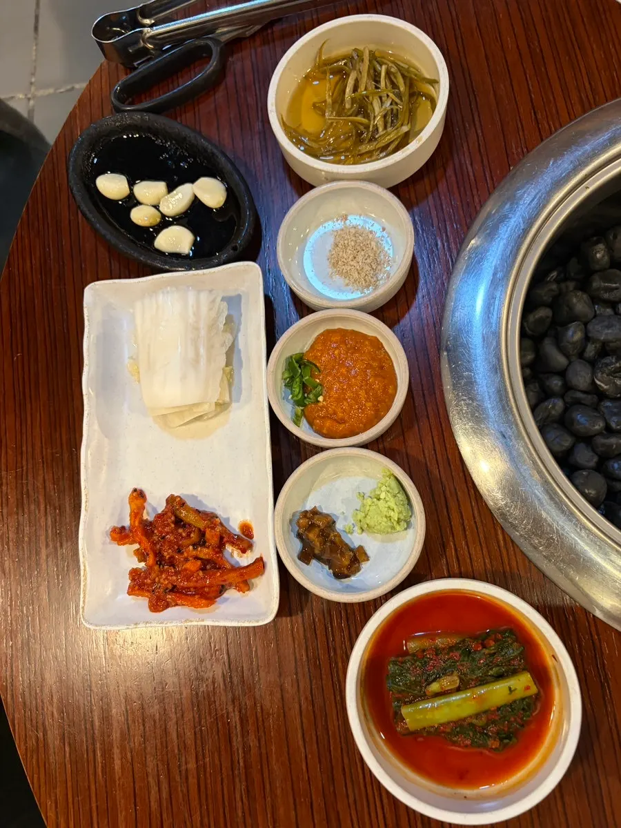 A plate with one serving each of gabrisal, whole pork belly, and galmaegisal