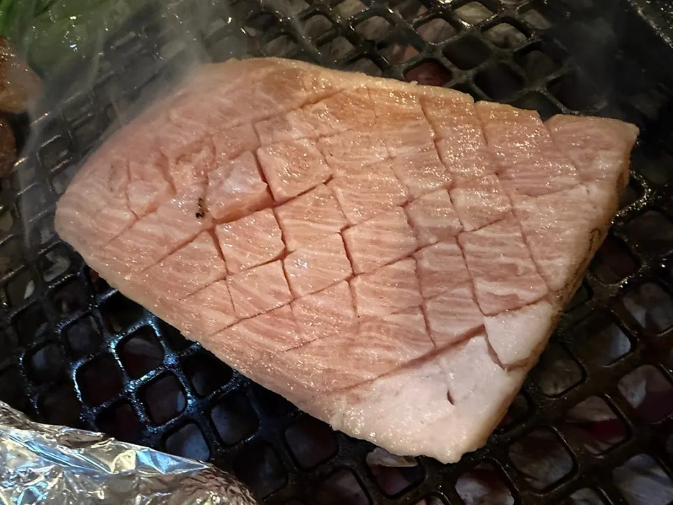 Crosshatched gabrisal grilling on the brazier