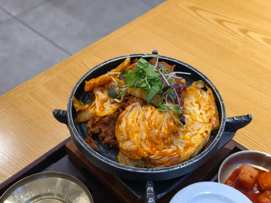 Grilled jeyuk set meal on a personal grill