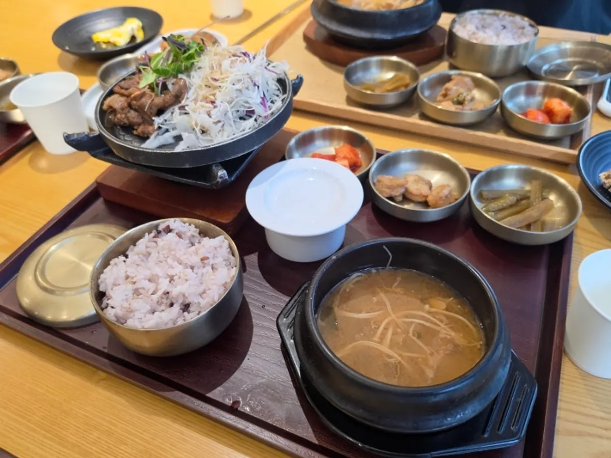 A spoonful of grilled jeyuk over white rice