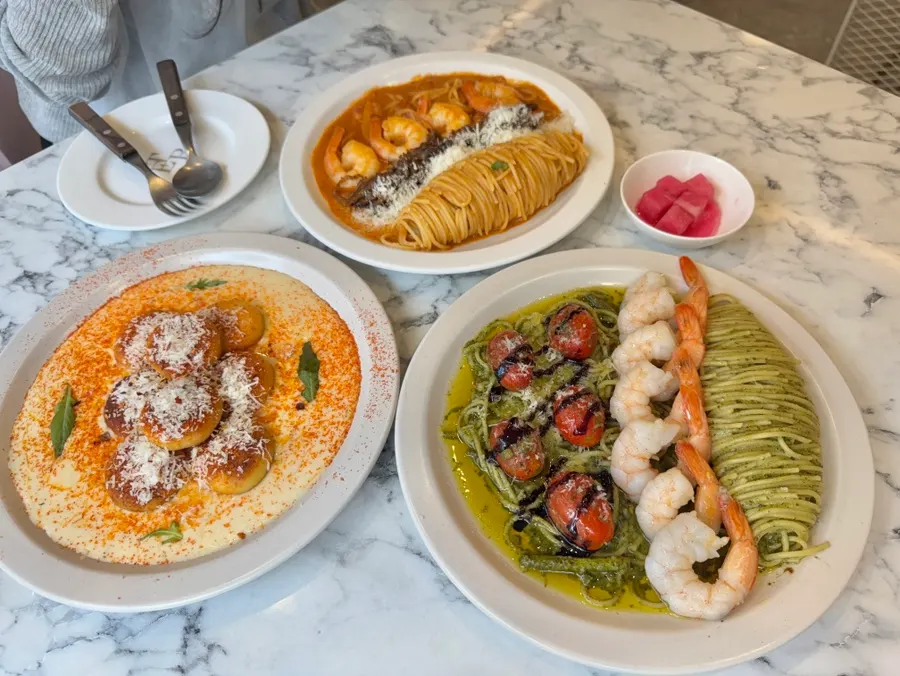 Table set with two pasta dishes and gnocchi