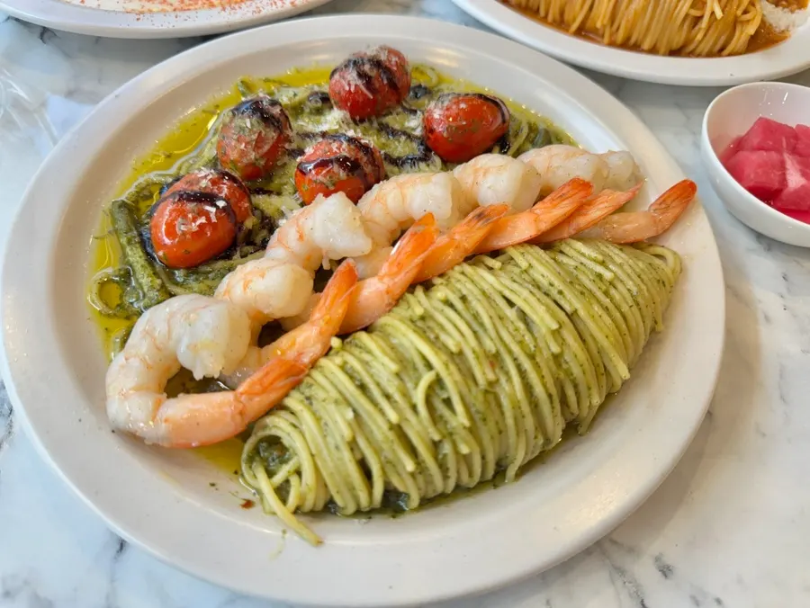 A plate of basil shrimp pasta