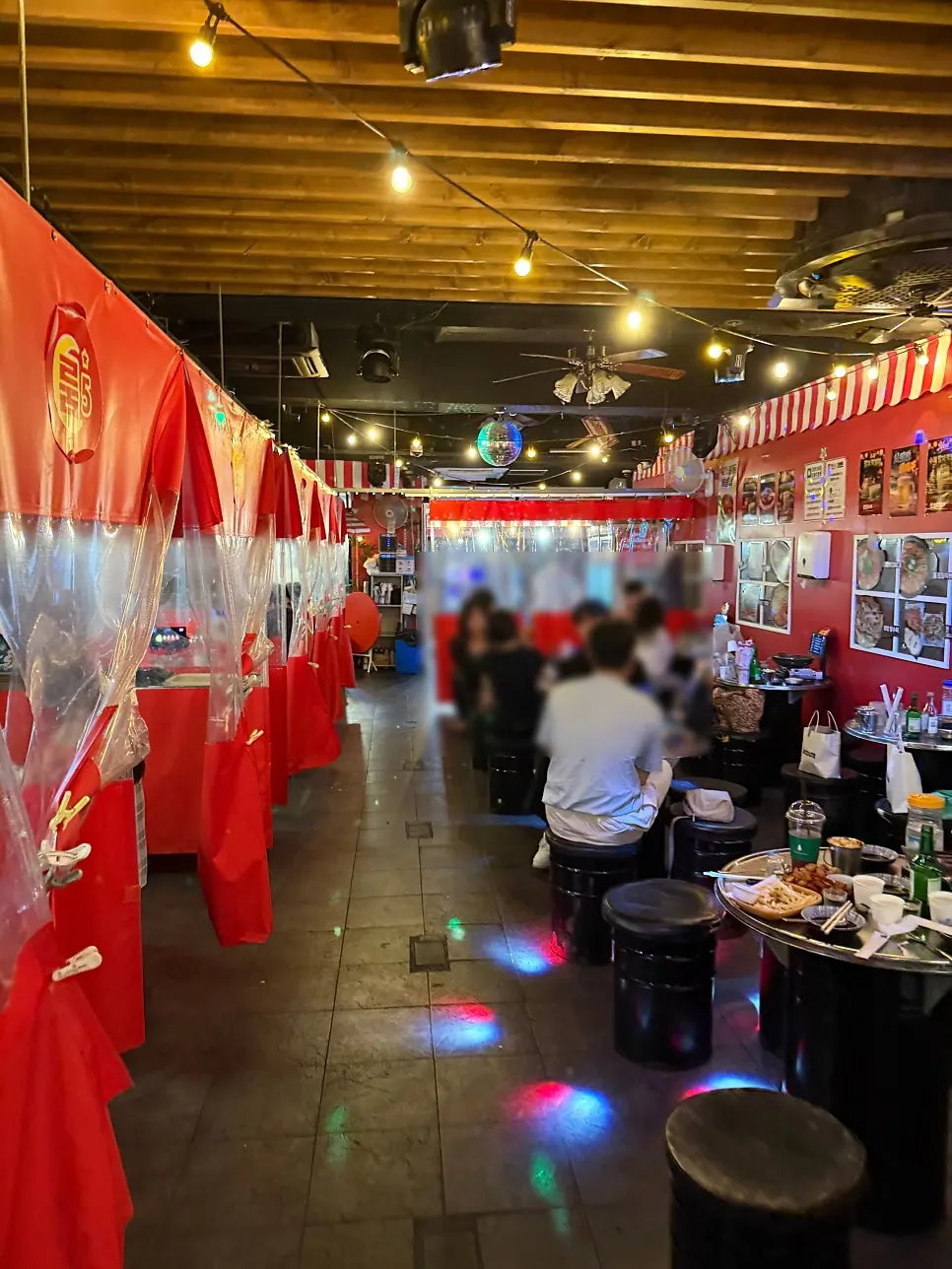 Interior decorated with red tents and lighting