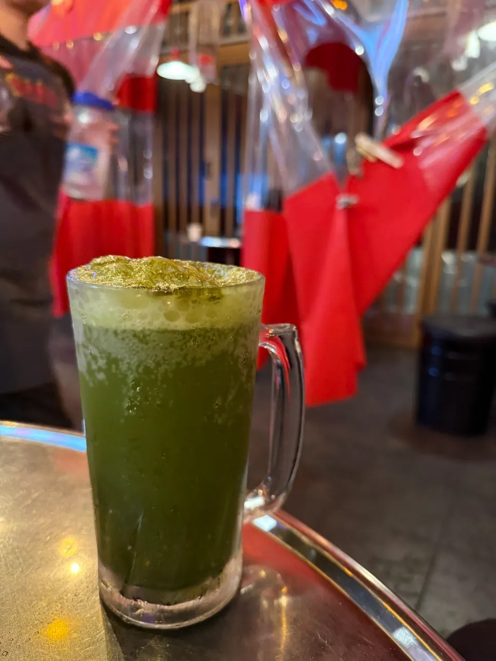A glass of the unusual matcha draft beer