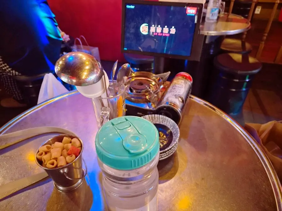 Basic side dish of snacks and water at Room Pojangmacha