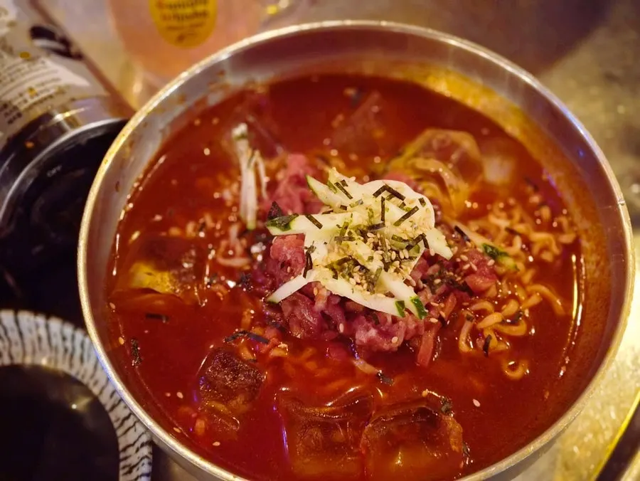 Hot yukhoe fire chicken cold noodles at Room Pojangmacha