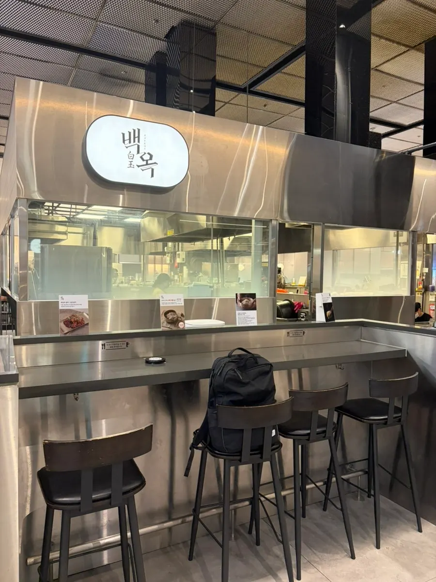 Seating and open kitchen inside Baekok Dongtan
