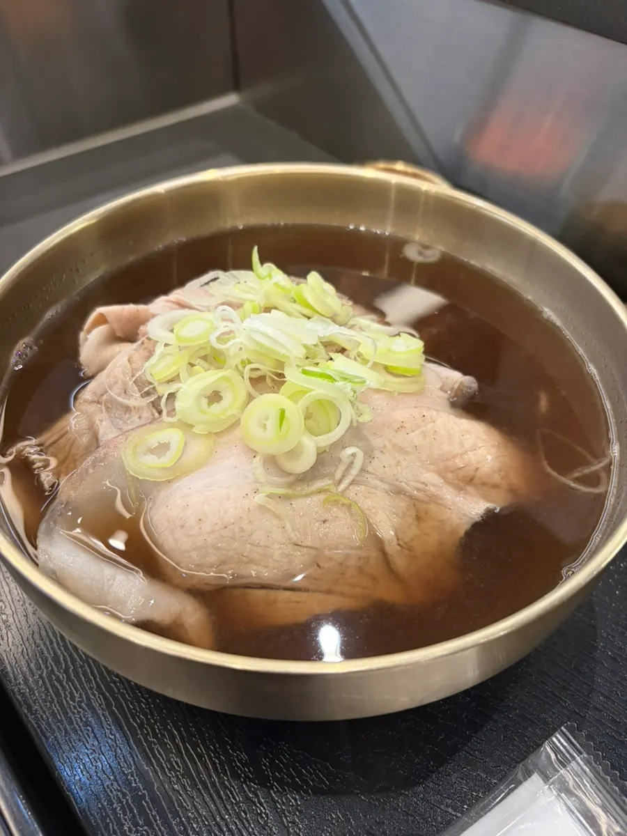 Herbal gomtang broth simmered with neungi mushrooms and herbal ingredients