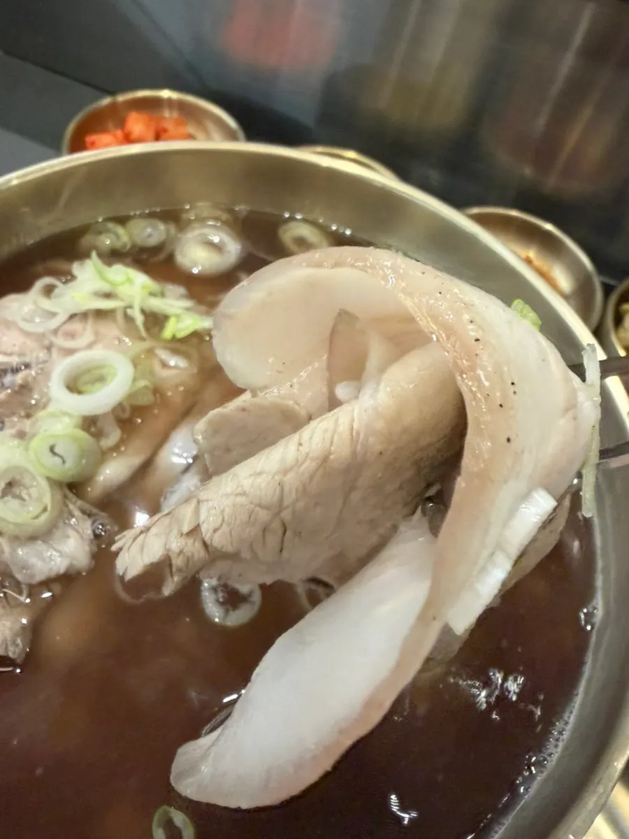 Spoonful of herbal gomtang broth