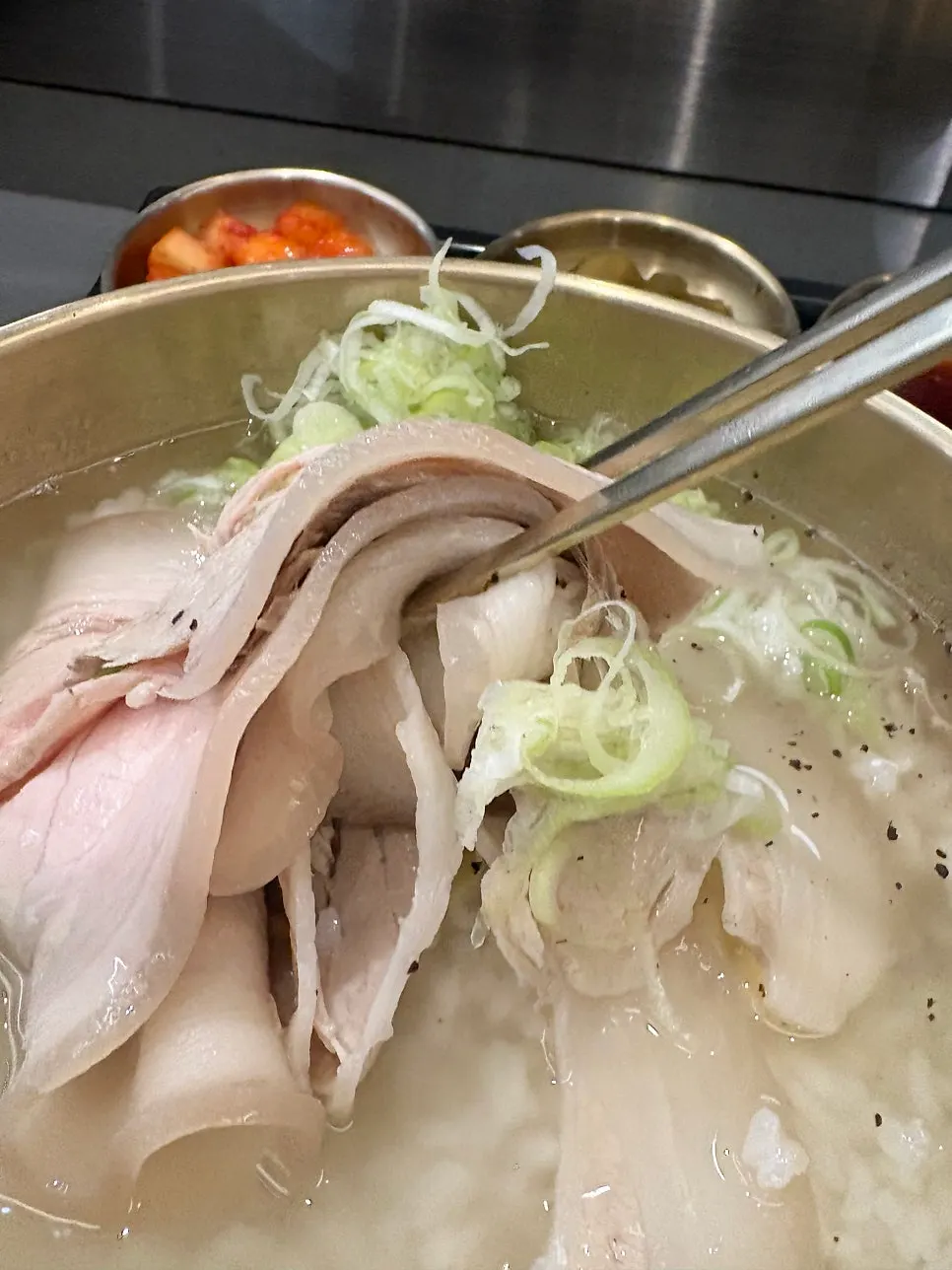 A bowl of Baekok pork gomtang generously filled with meat