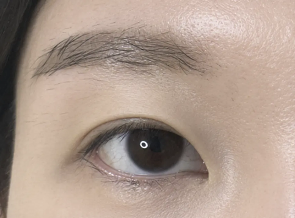 Lashes pointing downward before the perm
