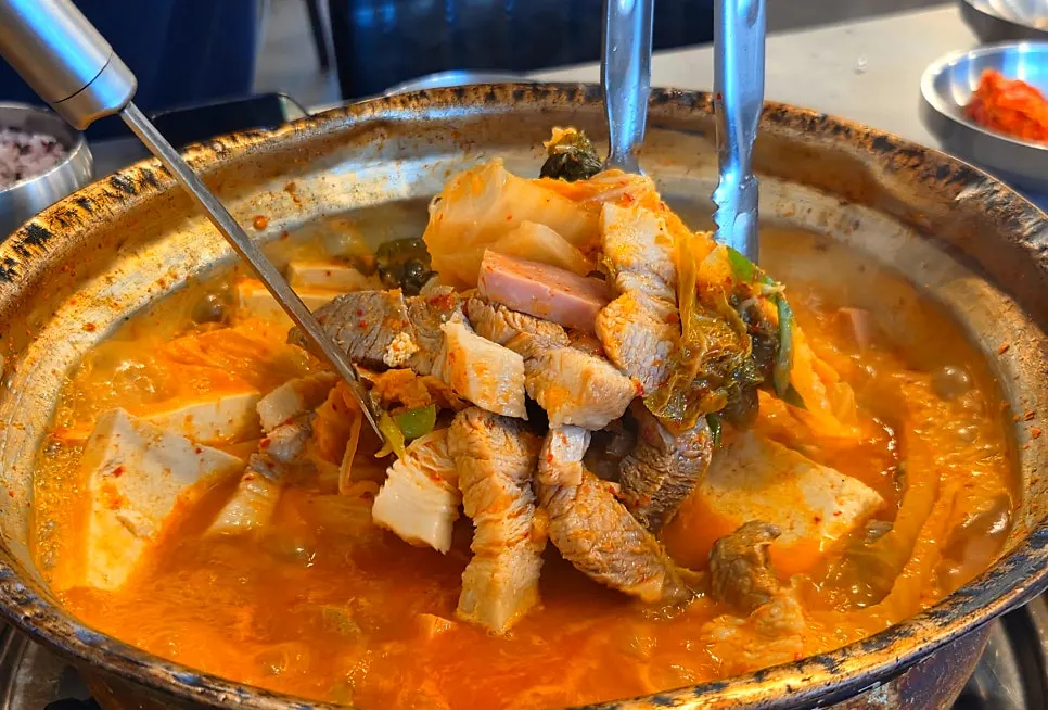 Yangpuni kimchi jjigae boiling with a rich broth