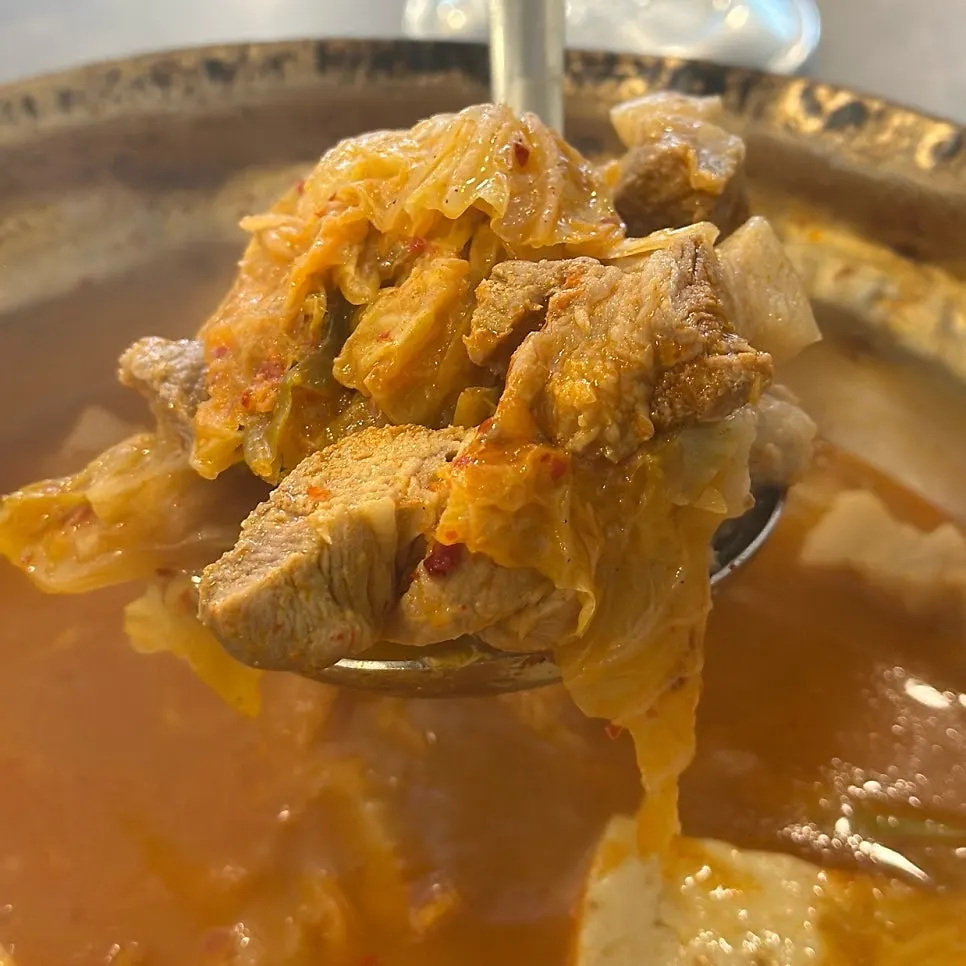 Full table spread of kimchi jjigae at Yangpuni Kimchi Jjigae & Samgyeopsal in Bansong-dong, Dongtan