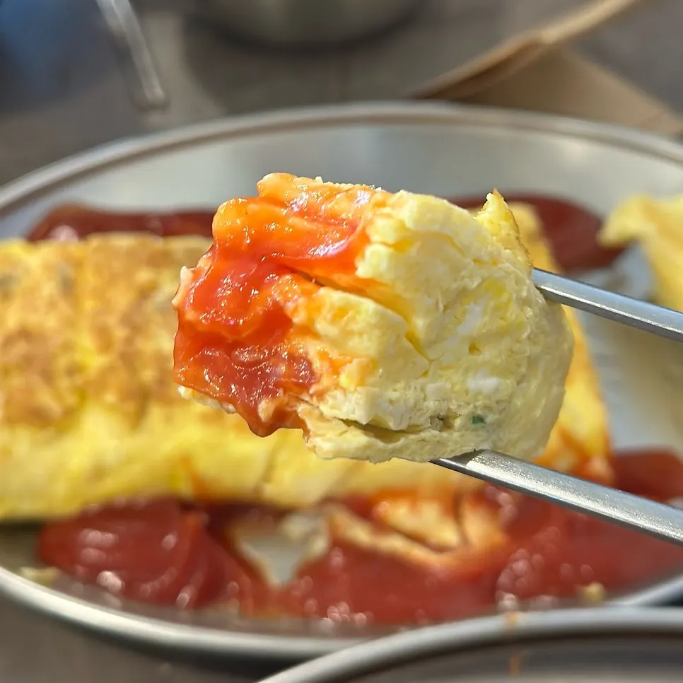 A plate of thick, generously sized egg roll