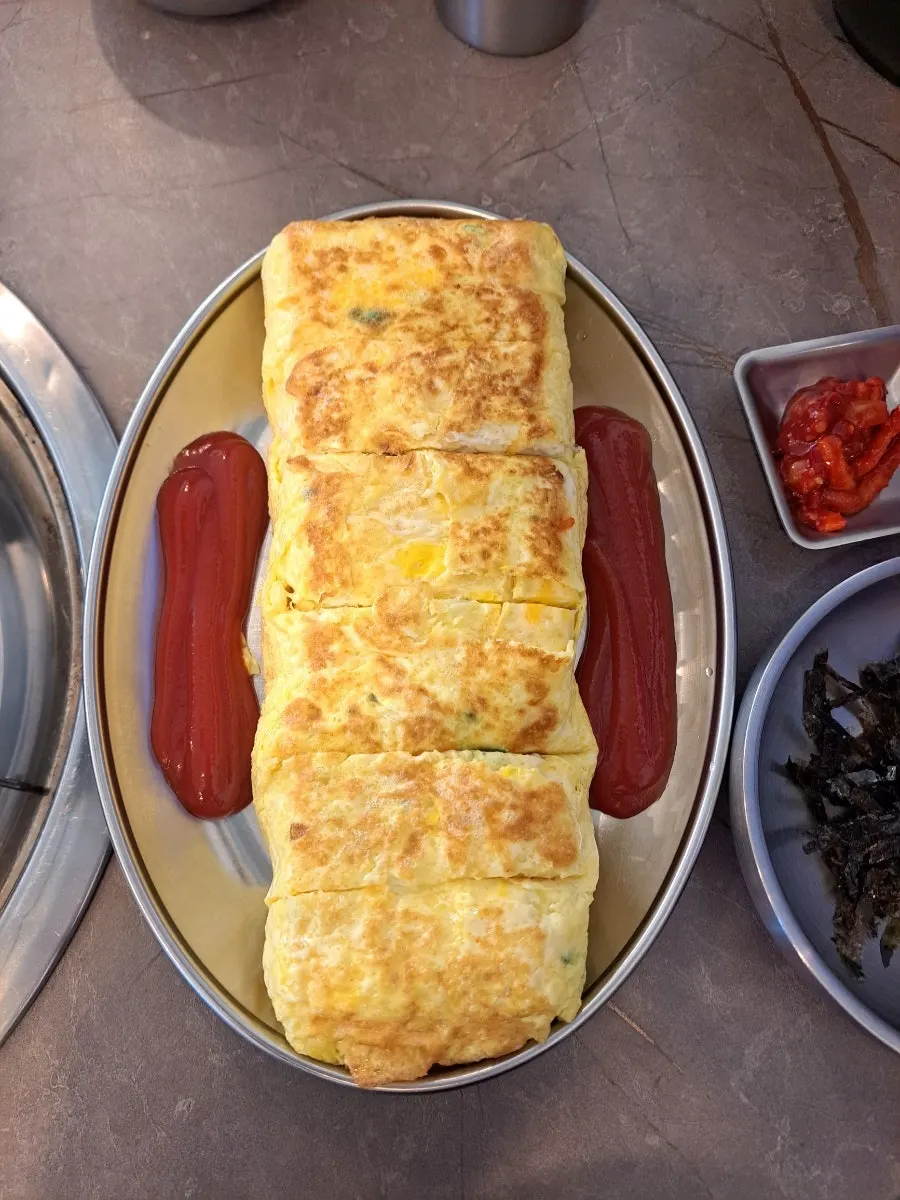 Thick egg roll filling the whole plate