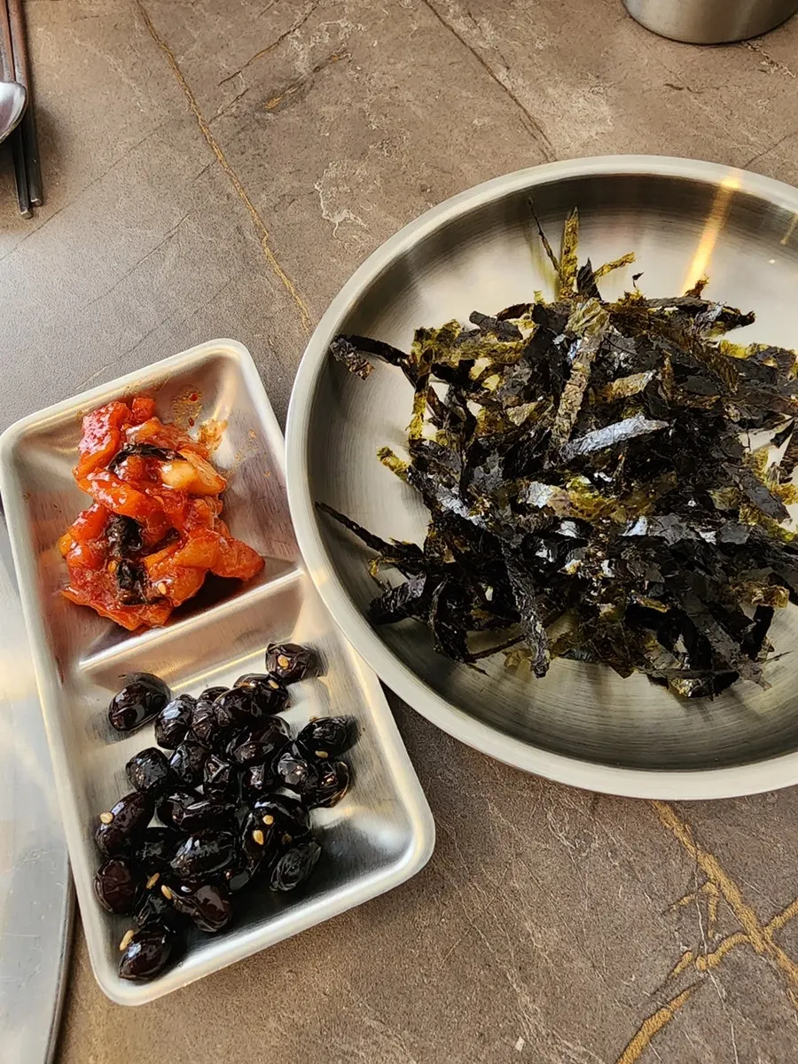 Basic side dishes of salted squid, beans, and laver