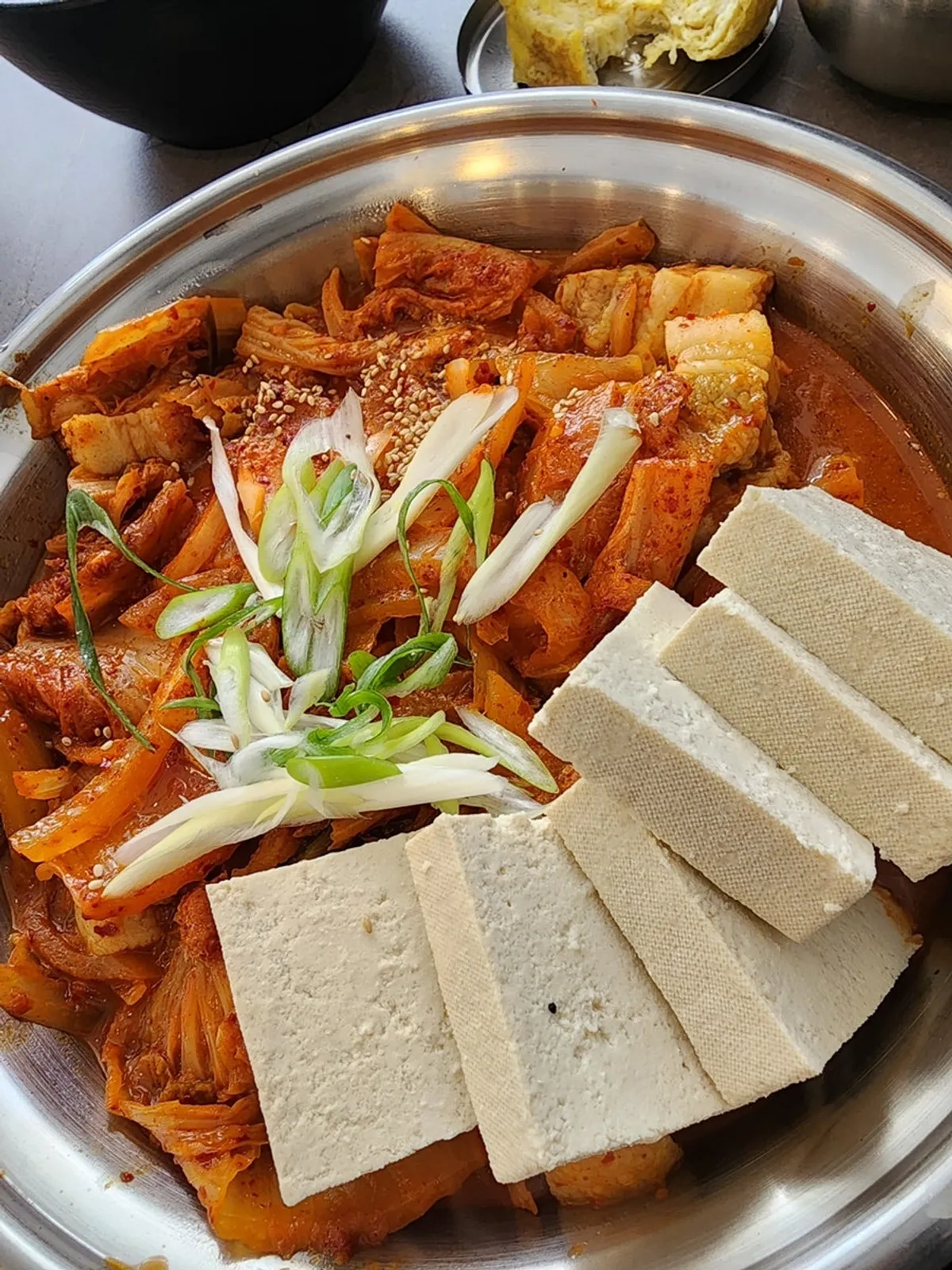Kimchi-jjim loaded with tofu and pork belly