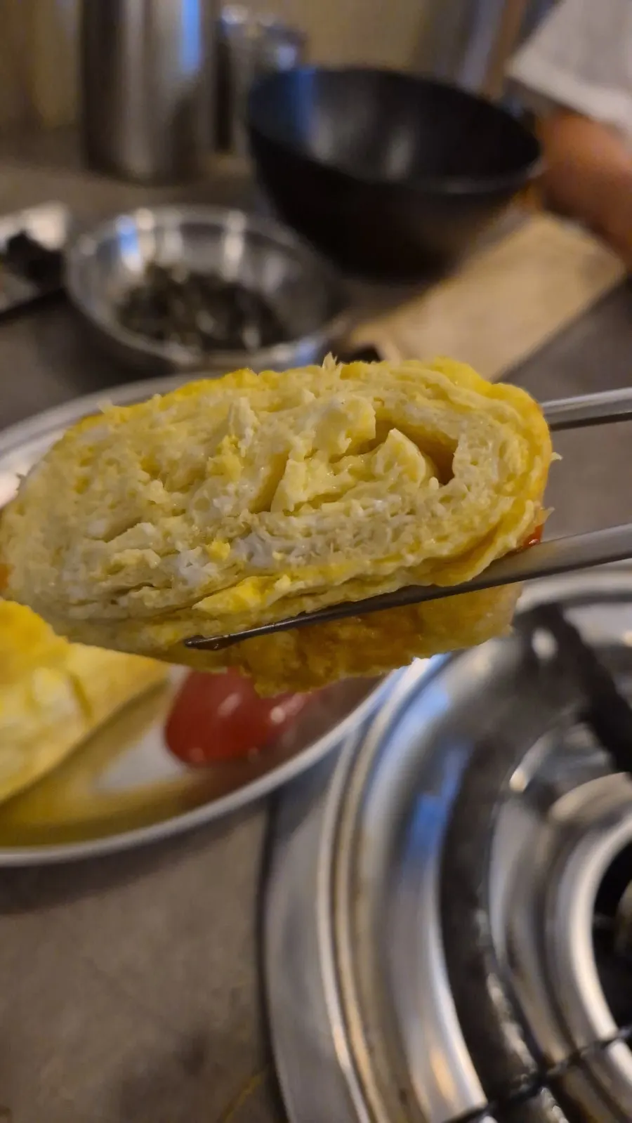 Plate of thick, golden egg roll