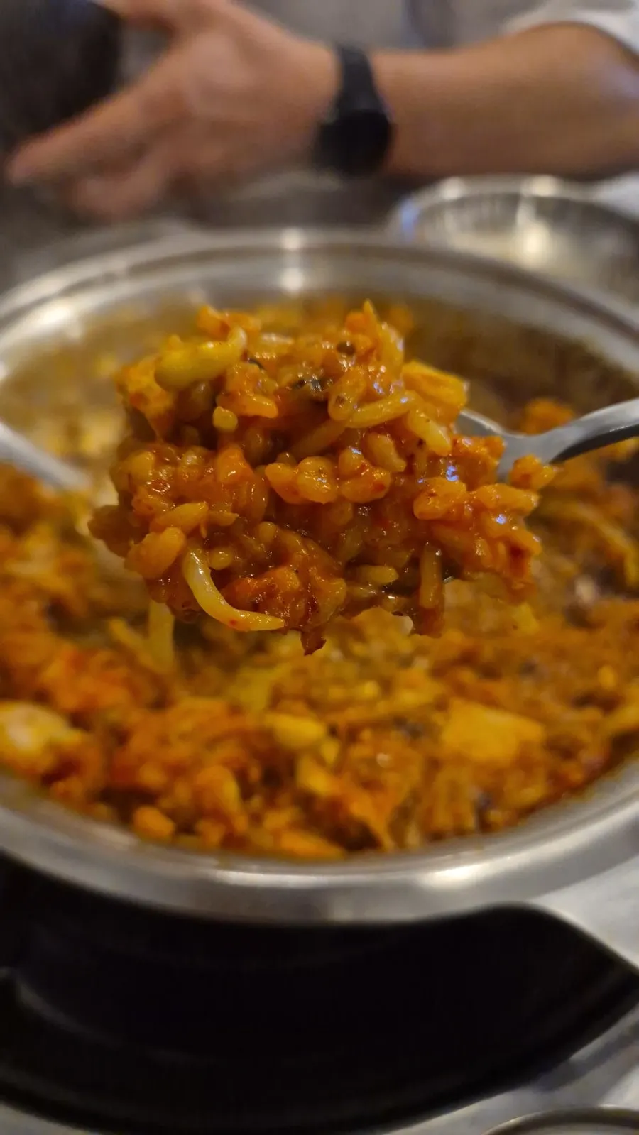 Mixed bowl of kimchi jjim rice with side dishes