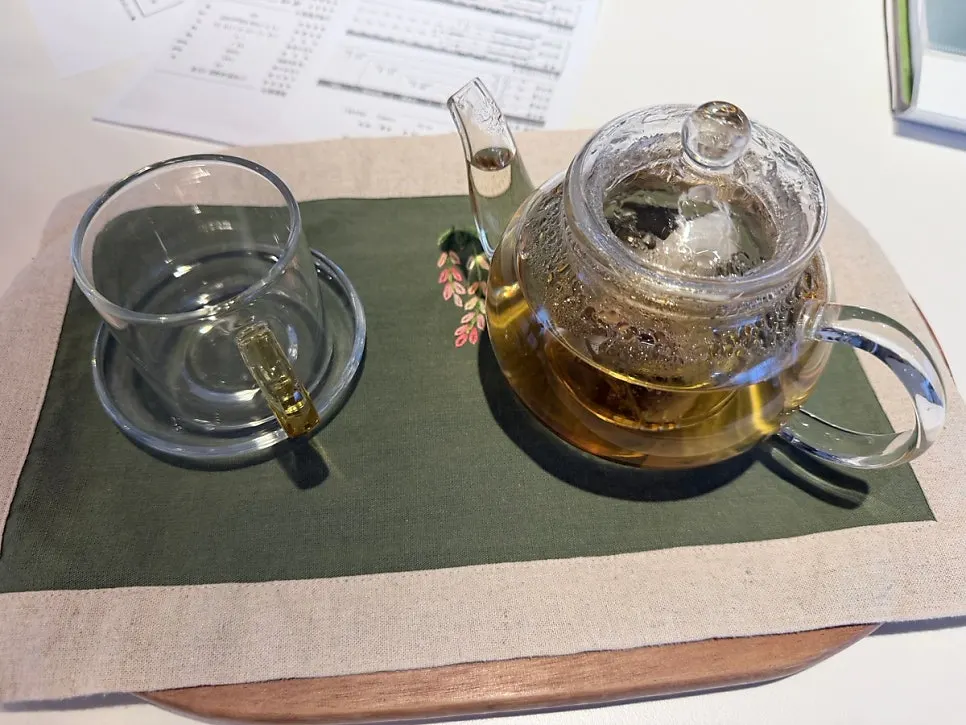 Warm constitution-matched tea served after the treatment