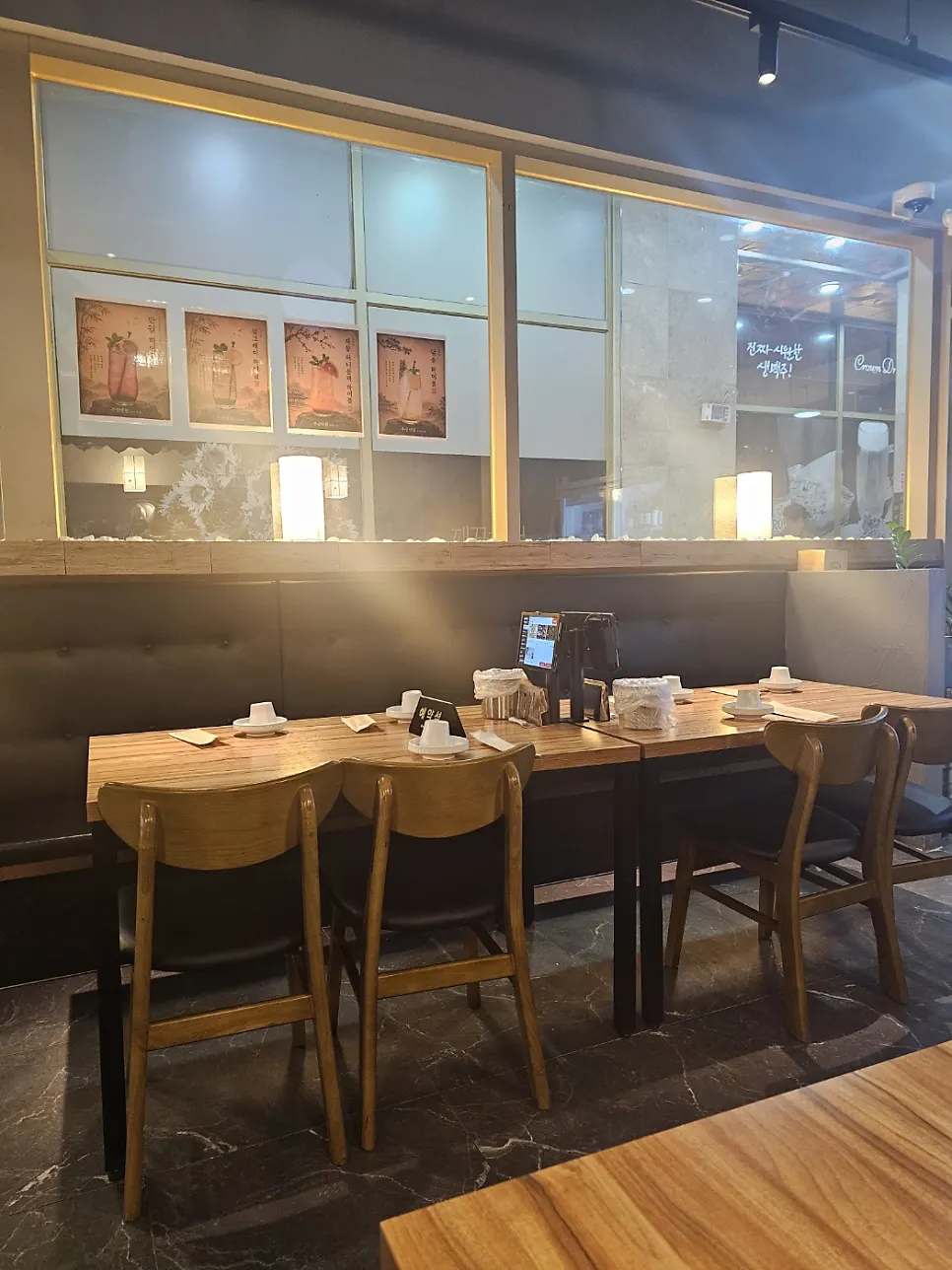 Interior with wood-tone tables and warm lighting