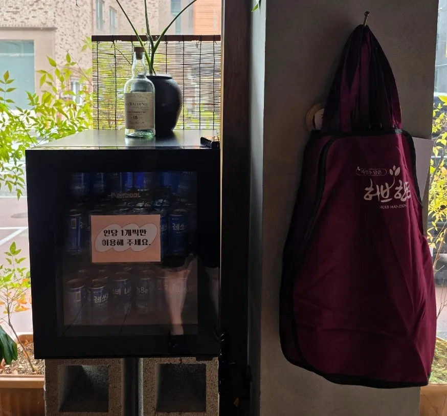 Self-serve bar corner with canned drinks