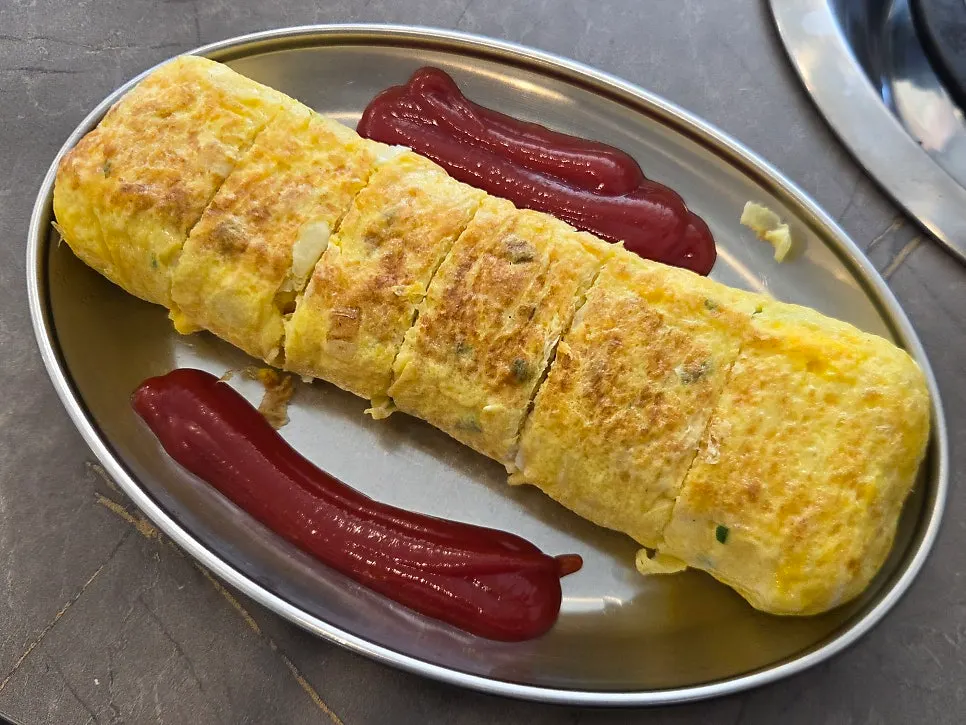 Thick, rolled egg roll on a plate