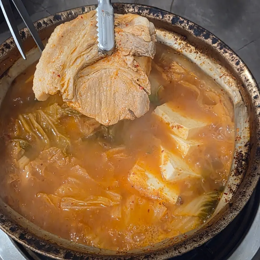 Thick cuts of pork in the kimchi jjigae