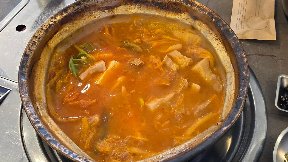 Kimchi jjigae with pork belly cut into bite-sized pieces