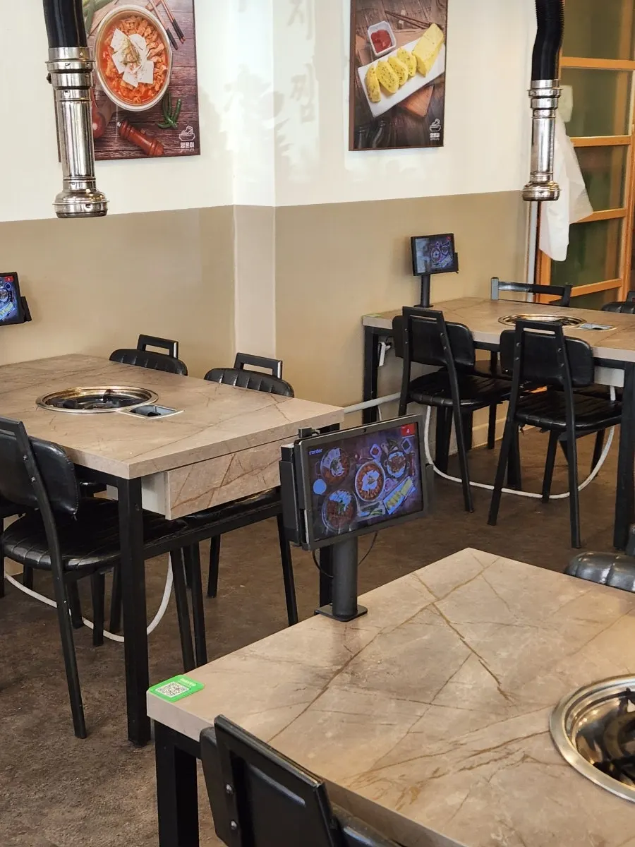 Clean, well-organized seating inside the restaurant