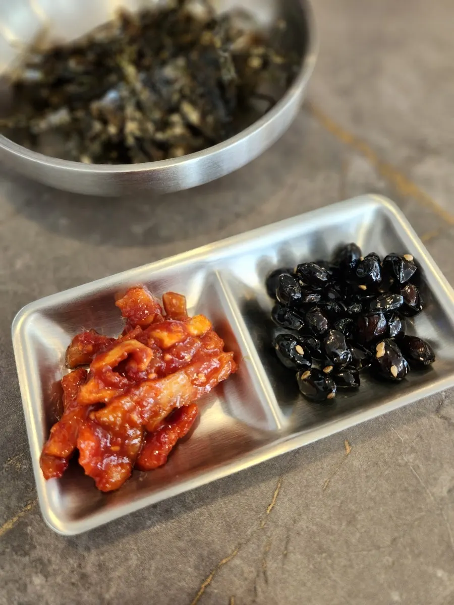 Table setting with dried radish and braised soybean side dishes