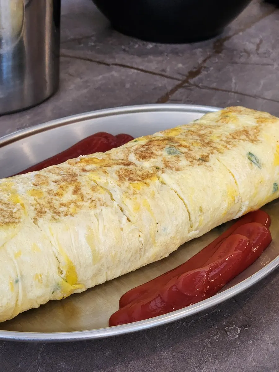 A plate of thickly sliced egg roll