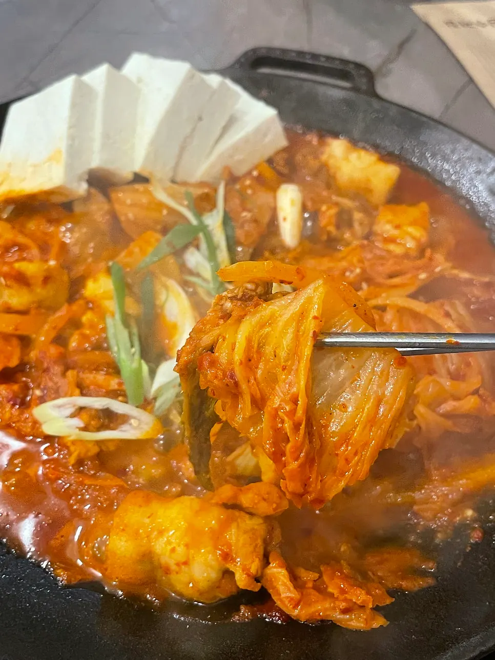 Close-up of the sweet, salty kimchi jjim sauce