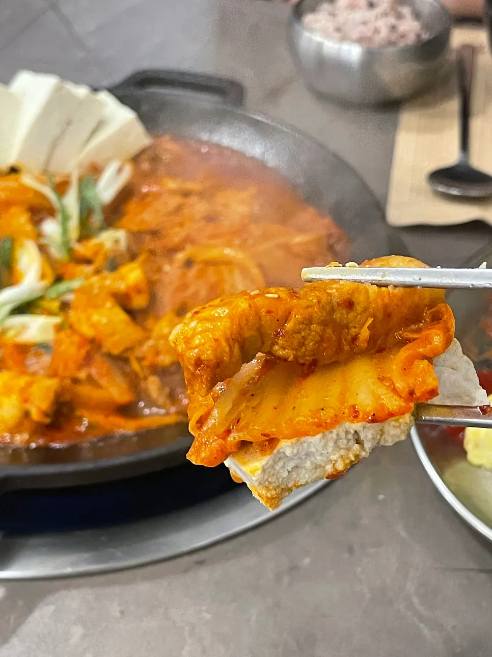 Pot of kimchi jjim nearing the end of the meal