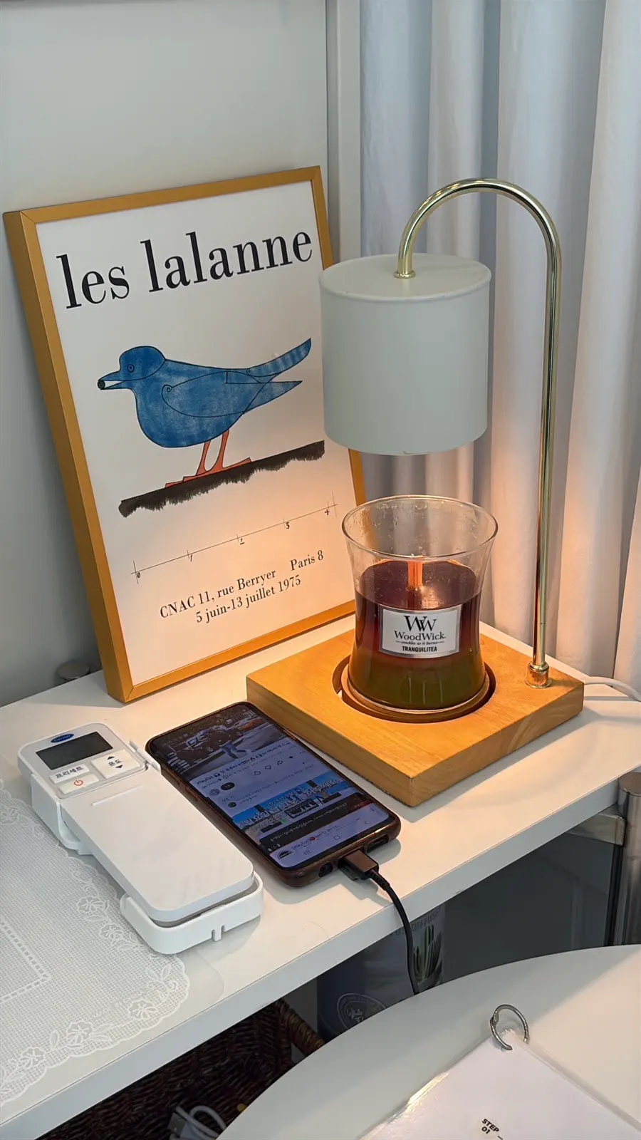 A shelf with scented candles and small decor items