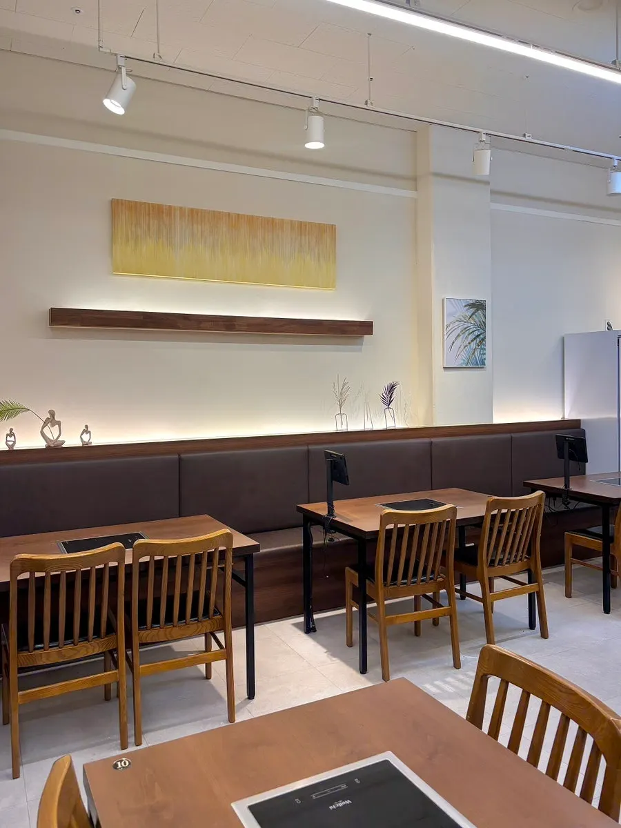 Interior of Deungchon Shabu Kalguksu busy with weekday evening guests