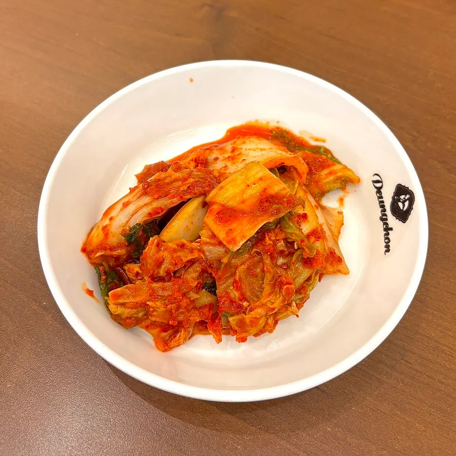 Basic side dishes and geotjeori kimchi plate at Deungchon Shabu Kalguksu