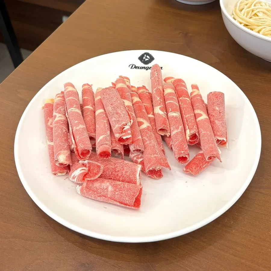 Shabu beef dipped in wasabi soy sauce