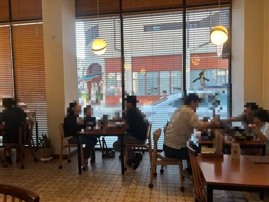 Kkot Gatsu interior with wood-tone lighting